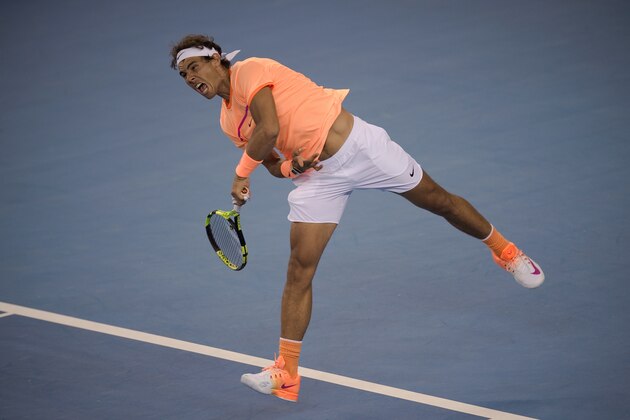 Rafael Nadal of Spain hits a return during his men's doubles first round match against Rohan Bopanna of India and Daniel Nestor of Canada at the China Open tennis tournament in Beijing on October 3, 2016.  / AFP / NICOLAS ASFOURI        (Photo credit should read NICOLAS ASFOURI/AFP/Getty Images)