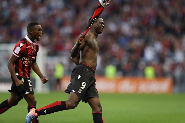 Nice's Italian forward Mario Balotelli (R) celebrates after scoring a goal with his teammate French midfielder Wylan Cyprien during the French L1 football match Nice (OGCN) vs Lorient (FCL) on October 2, 2016 at the 'Allianz Riviera' stadium in Nice, southeastern France. / AFP / VALERY HACHE        (Photo credit should read VALERY HACHE/AFP/Getty Images)