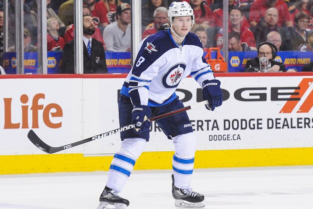 CALGARY, AB - MARCH 16: Jacob Trouba #8 of the Winnipeg Jets in action against the Calgary Flames during an NHL game at Scotiabank Saddledome on March 16, 2016 in Calgary, Alberta, Canada. (Photo by Derek Leung/Getty Images)