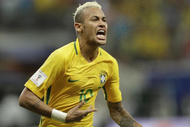 FILE - In this Sept. 6, 2016 file photo, Brazil's Neymar celebrates scoring his side's 2nd goal against Colombia during a 2018 World Cup qualifying soccer match in Manaus, Brazil. Brazil rises from ninth to fourth in the FIFA rankings, which is still led by Argentina. (AP Photo/Andre Penner, File)