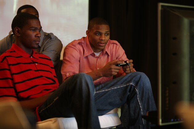 PHOENIX - FEBRUARY 12:  (L-R) Kevin Durant #35 and Russell Westbrook #0 of the Oklahoma City Thunder play video games during the All Star Media Availability as part of the 2009 NBA All-Star Weekend on February 12, 2009 at the Sheraton Downtown hotel in Phoenix, Arizona.  NOTE TO USER: User expressly acknowledges and agrees that, by downloading and/or using this Photograph, user is consenting to the terms and conditions of the Getty Images License Agreement. Mandatory Copyright Notice: Copyright 2009 NBAE (Photo by David Sherman/NBAE via Getty Images).