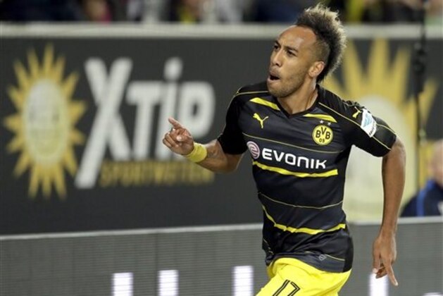 Dortmund's Pierre-Emerick Aubameyang celebrates after scoring his side's 2nd goal during the German Bundesliga soccer match between VfL Wolfsburg and Borussia Dortmund in Wolfsburg, Germany, Tuesday, Sept. 20, 2016. (AP Photo/Michael Sohn)