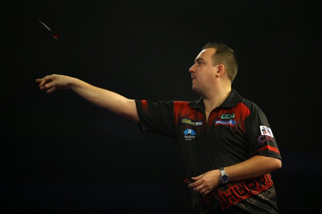 LONDON, ENGLAND - DECEMBER 18:  Kim Huybrechts  in action during his first round match against David Pallett on day two of the 2016 William Hill PDC World Darts Championships at Alexandra Palace on December 18, 2015 in London, England.  (Photo by Richard Heathcote/Getty Images)