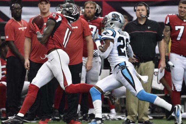Atlanta Falcons wide receiver Julio Jones (11) makes a catch against Carolina Panthers cornerback Daryl Worley (26) during the first half of an NFL football game, Sunday, Oct. 2, 2016, in Atlanta. (AP Photo/Rainier Ehrhardt)