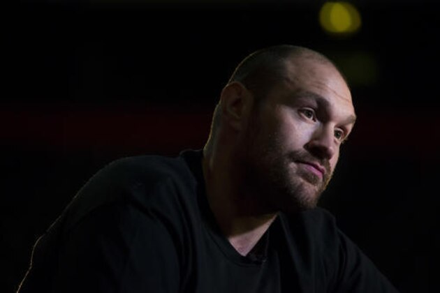 Britain's Tyson Fury the heavyweight world boxing champion is interviewed after attending a press conference in Manchester, England, Wednesday, April 27, 2016. Fury is scheduled for a rematch against and Ukrainian Wladimir Klitschko on Saturday July 9 at the Manchester Arena. (AP Photo/Jon Super)