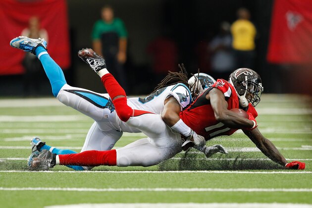 ATLANTA, GA - OCTOBER 02:  Julio Jones #11 of the Atlanta Falcons dives for more yardage as he is tackled by Tre Boston #33 of the Carolina Panthers at Georgia Dome on October 2, 2016 in Atlanta, Georgia.  (Photo by Kevin C. Cox/Getty Images)