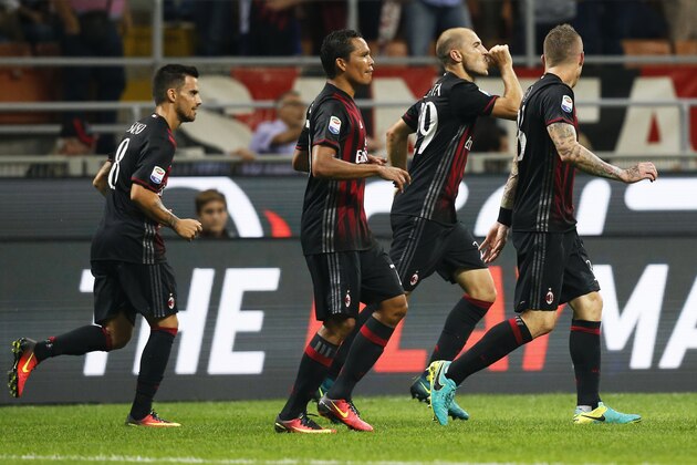 AC Milan's defender Gabriel Paletta (2ndR) celebrates after scoring during the Italian Serie A football match AC Milan vs Sassuolo on October 2, 2016 at the San Siro stadium in Milan.  / AFP / MARCO BERTORELLO        (Photo credit should read MARCO BERTORELLO/AFP/Getty Images)