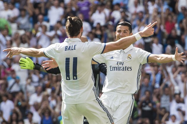 MADRID - SEPTEMBER 10: Cristiano Ronaldo of Real Madrid celebrates with teammate Gareth Bale during the La Liga match between Real Madrid and Osasuna at the Santiago Bernabeu Stadium on 10 September 2016 in Madrid, Spain. (Photo by Power Sport Images/Getty Images)