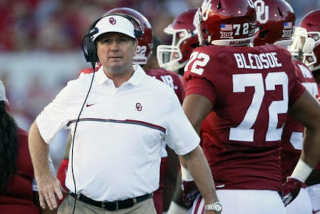 FILE - In this Sept. 10, 2016, file photo, Oklahoma head coach Bob Stoops iwatches an NCAA college football game against Louisiana Monroe in Norman, Okla. The Sooners are 0-0 in the quest to repeat as Big 12 champions and win the league for the 10th time under Stoops. (AP Photo/Sue Ogrocki, File)