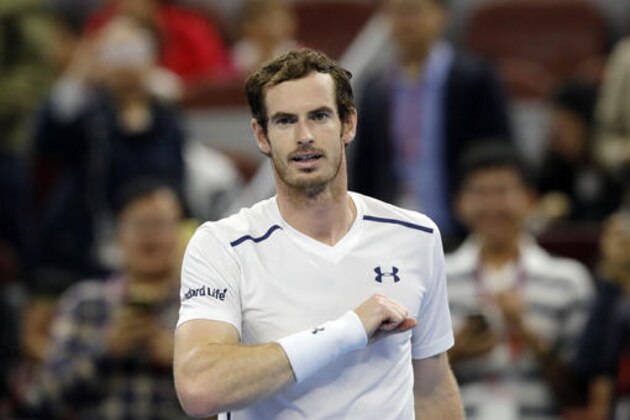 Andy Murray of Britain celebrates defeating Andrey Kuznetsov  of Russia in a men's singles match at the China Open tennis tournament at the Diamond Court in Beijing, Wednesday, Oct. 5, 2016. (AP Photo/Andy Wong)