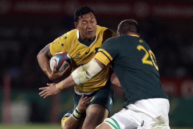 Australia’s Israel Folau, left, is tackled by South Africa’s Willem Alberts, right, and teammate Morne Steyn, during the Rugby Championship match between South Africa and Australia, at Loftus Versfeld in Pretoria, South Africa, Saturday, Oct. 1, 2016. (AP Photo/Themba Hadebe)