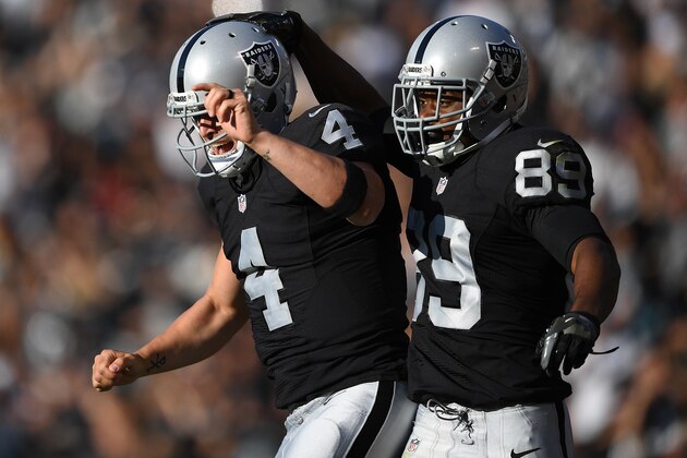 OAKLAND, CA - AUGUST 27:  Wide receiver Amari Cooper #89 and quarterback Derek Carr #4 of the Oakland Raiders celebrates after Carr threw a touchdown pass to Cooper against the Tennessee Titans in the first half of their preseason football game at the Oakland Coliseum on August 27, 2016 in Oakland, California.  (Photo by Thearon W. Henderson/Getty Images)