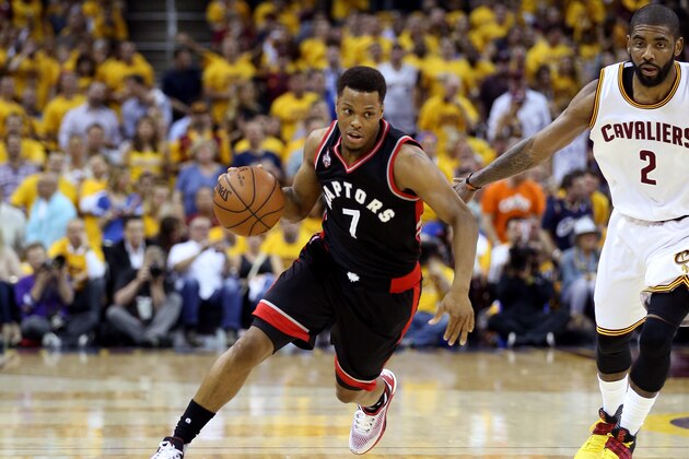 CLEVELAND, OH - MAY 25: Kyle Lowry #7 of the Toronto Raptors handles the ball in the first quarter against Kyrie Irving #2 of the Cleveland Cavaliers in game five of the Eastern Conference Finals during the 2016 NBA Playoffs at Quicken Loans Arena on May 25, 2016 in Cleveland, Ohio. NOTE TO USER: User expressly acknowledges and agrees that, by downloading and or using this photograph, User is consenting to the terms and conditions of the Getty Images License Agreement.  (Photo by Andy Lyons/Getty Images)