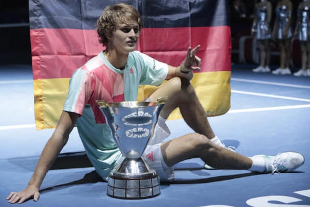 Alexander Zverev of Germany poses with his trophy after winning the St. Petersburg Open ATP tennis tournament final match against Stan Wawrinka of Switzerland in St. Petersburg, Russia, Sunday, Sept. 25, 2016. (AP Photo/Dmitri Lovetsky)