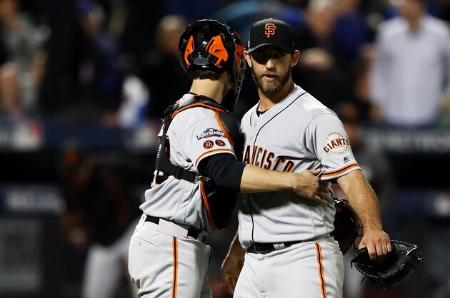 NEW YORK, NY - OCTOBER 05:  Madison Bumgarner #40 and Buster Posey #28 of the San Francisco Giants celebrate their 3-0 win over the New York Mets during their National League Wild Card game at Citi Field on October 5, 2016 in New York City.  (Photo by Elsa/Getty Images)