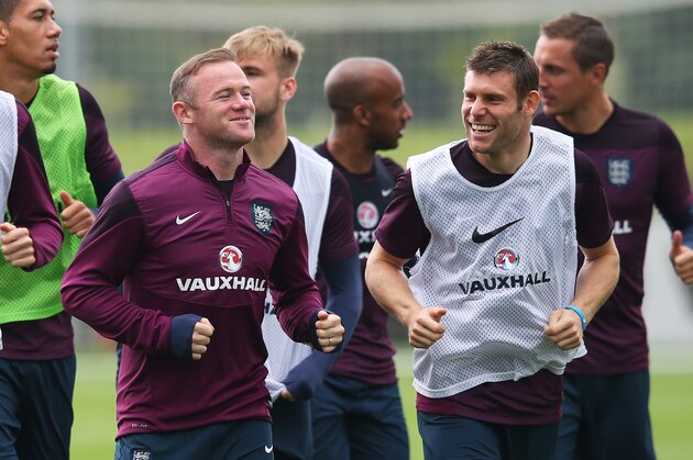 BURTON-UPON-TRENT, ENGLAND - SEPTEMBER 02:  (L- R) Michael Carrick, Wayne Rooney and James Milner warm up during the England training session at St Georges Park on September 2, 2015 in Burton-upon-Trent, England.  (Photo by Alex Livesey/Getty Images)