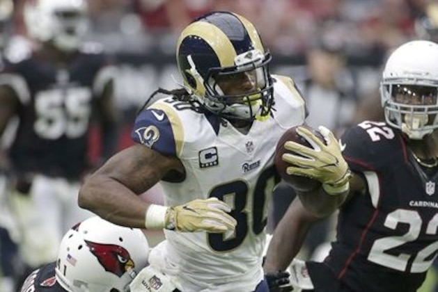 Los Angeles Rams running back Todd Gurley (30) makes a catch as Arizona Cardinals defensive back Marcus Cooper, left, defends during the second half of an NFL football game, Sunday, Oct. 2, 2016, in Glendale, Ariz. (AP Photo/Rick Scuteri)
