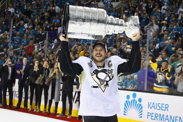 SAN JOSE, CA - JUNE 12:  Sidney Crosby #87 of the Pittsburgh Penguins celebrates with the Stanley Cup after their 3-1 victory to win the Stanley Cup against the San Jose Sharks in Game Six of the 2016 NHL Stanley Cup Final at SAP Center on June 12, 2016 in San Jose, California.  (Photo by Bruce Bennett/Getty Images)