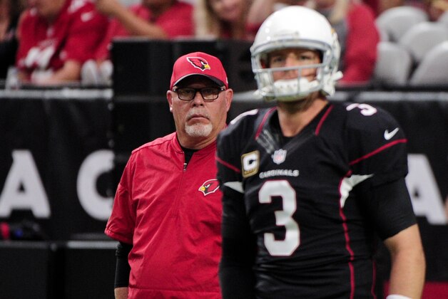 Oct 2, 2016; Glendale, AZ, USA; Arizona Cardinals head coach Bruce Arians (L) watches as quarterback Carson Palmer (3) warm up prior to the game against the Los Angeles Rams at University of Phoenix Stadium. Mandatory Credit: Matt Kartozian-USA TODAY Sports