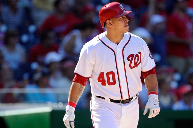WASHINGTON, DC - AUGUST 28:  Wilson Ramos #40 of the Washington Nationals hits a home run in the seventh inning against the Colorado Rockies at Nationals Park on August 28, 2016 in Washington, DC.  (Photo by G Fiume/Getty Images)