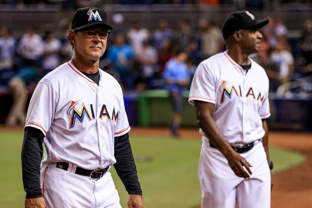 MIAMI, FL - AUGUST 26: dManager Don Mattingly #8 and hitting coach Barry Bonds #25 of the Miami Marlins walk off the field after the game against the San Diego Padres at Marlins Park on  August 26, 2016 in Miami, Florida. (Photo by Rob Foldy/Getty Images)