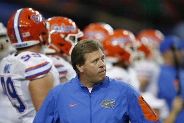 Florida head coach Jim McElwain walks before the first half of the Southeastern Conference championship NCAA college football game between Alabama and Florida, Saturday, Dec. 5, 2015, in Atlanta. (AP Photo/John Bazemore)