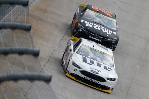 DOVER, DE - OCTOBER 02:  Brad Keselowski, driver of the #2 Miller Lite Ford, leads Martin Truex Jr., driver of the #78 Furniture Row/Denver Mattress Toyota, during the NASCAR Sprint Cup Series Citizen Solider 400 at Dover International Speedway on October 2, 2016 in Dover, Delaware.  (Photo by Brian Lawdermilk/Getty Images)