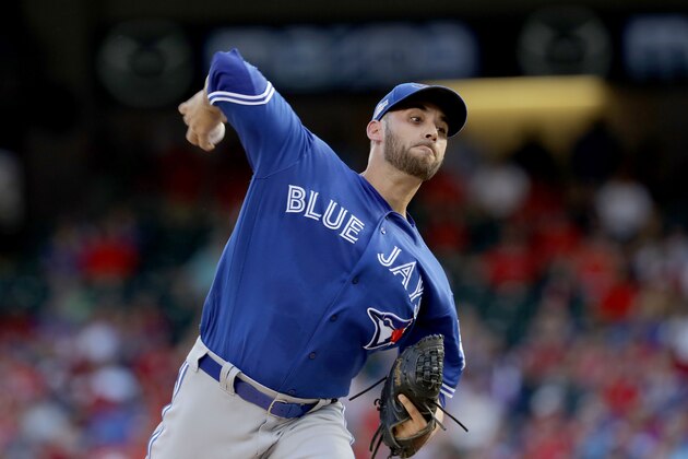 ARLINGTON, TX - OCTOBER 06:  Marco Estrada #25 of the Toronto Blue Jays throws a pitch against the Texas Rangers during the first inning in game one of the American League Divison Series at Globe Life Park in Arlington on October 6, 2016 in Arlington, Texas.  (Photo by Ronald Martinez/Getty Images)