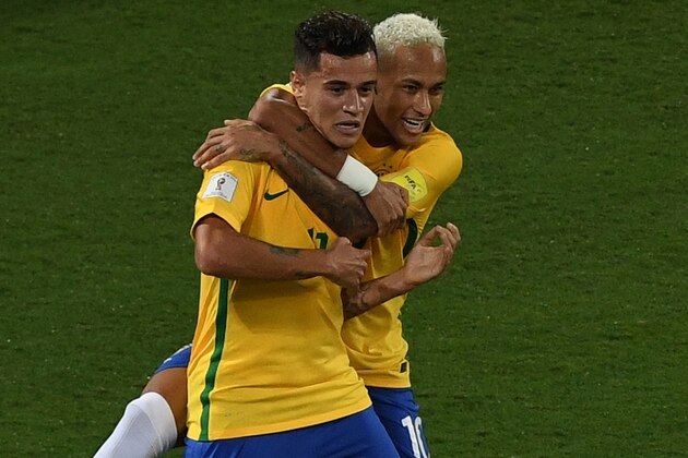 Brazil's Philippe Coutinho (L) celebrates his goal against Bolivia with teammate Neymar  during their Russia 2018 World Cup qualifier football match in Natal, Brazil, on October 6, 2016. / AFP / VANDERLEI ALMEIDA        (Photo credit should read VANDERLEI ALMEIDA/AFP/Getty Images)