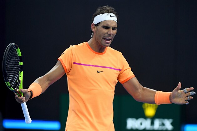 Rafael Nadal of Spain reacts after losing a point against Adrian Mannarino of France during their second round men's singles match at the China Open tennis tournament in Beijing on October 6, 2016. / AFP / WANG ZHAO        (Photo credit should read WANG ZHAO/AFP/Getty Images)