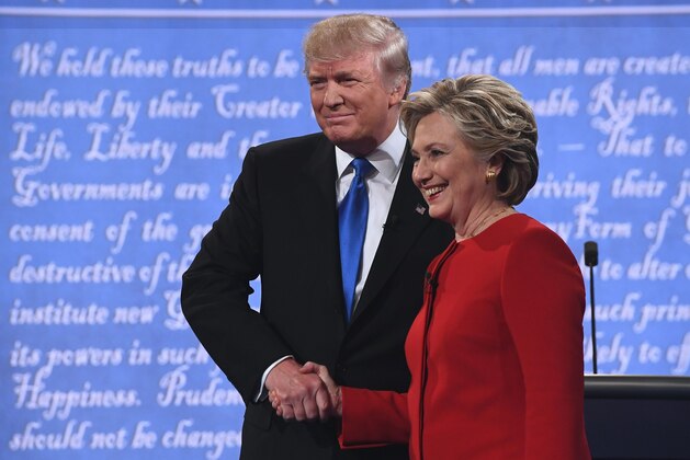 Democratic nominee Hillary Clinton (R) shakes hands with Republican nominee Donald Trump during the first presidential debate at Hofstra University in Hempstead, New York on September 26, 2016. / AFP / Jewel SAMAD        (Photo credit should read JEWEL SAMAD/AFP/Getty Images)