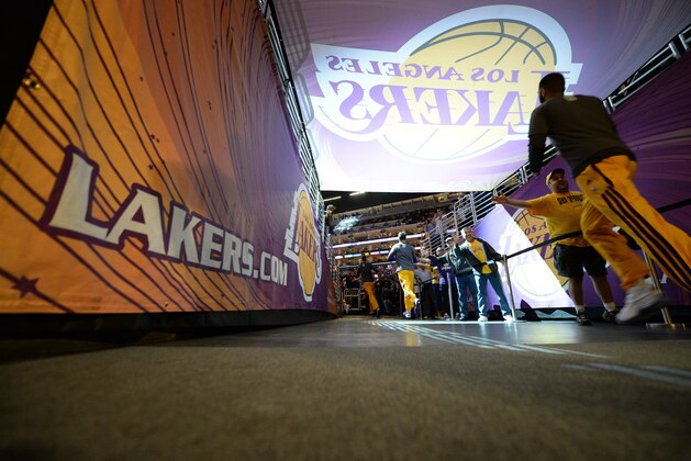 LOS ANGELES, CA - APRIL 8: The Los Angeles Lakers make their way out to the court to face the Houston Rockets at Staples Center on April 8, 2014 in Los Angeles, California. NOTE TO USER: User expressly acknowledges and agrees that, by downloading and/or using this Photograph, user is consenting to the terms and conditions of the Getty Images License Agreement. Mandatory Copyright Notice: Copyright 2014 NBAE (Photo by Noah Graham/NBAE via Getty Images)