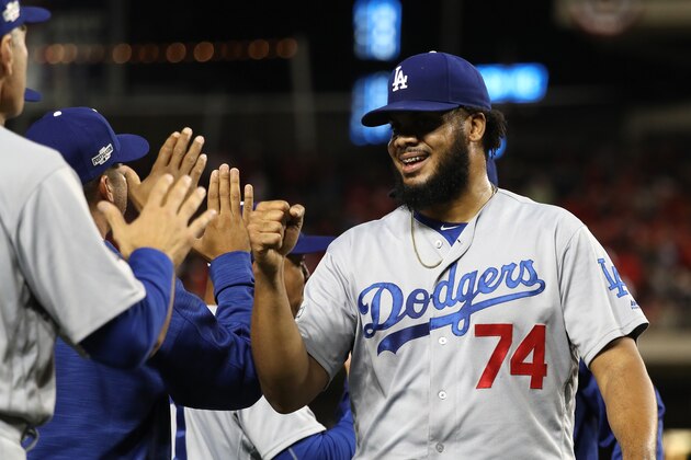 WASHINGTON, DC - OCTOBER 7: Kenley Jansen #74 of the Los Angeles Dodgers celebrates with teammates after the Los Angeles Dodgers defeated the Washington Nationals 4-3 in game one of the National League Division Series at Nationals Park on October 7, 2016 in Washington, DC. (Photo by Rob Carr/Getty Images)