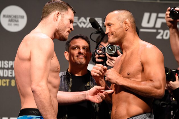 MANCHESTER, ENGLAND - OCTOBER 07:  (L-R) UFC middleweight champion Michael Bisping and Dan Henderson of the United States face-off during the UFC 204 weigh-in at the Manchester Central Convention Complex on October 7, 2016 in Manchester, England. (Photo by Josh Hedges/Zuffa LLC/Zuffa LLC via Getty Images)