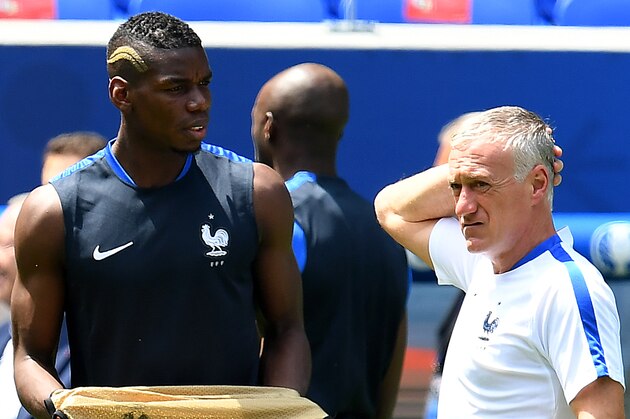 France's head coach Didier Deschamps (R) reacts next to France's midfielder Paul Pogba during a training session at the Parc Olympique Stadium in Lyon, on June 25, 2016 on the eve of the Euro 2016 football match between France and Ireland. / AFP / FRANCK FIFE        (Photo credit should read FRANCK FIFE/AFP/Getty Images)