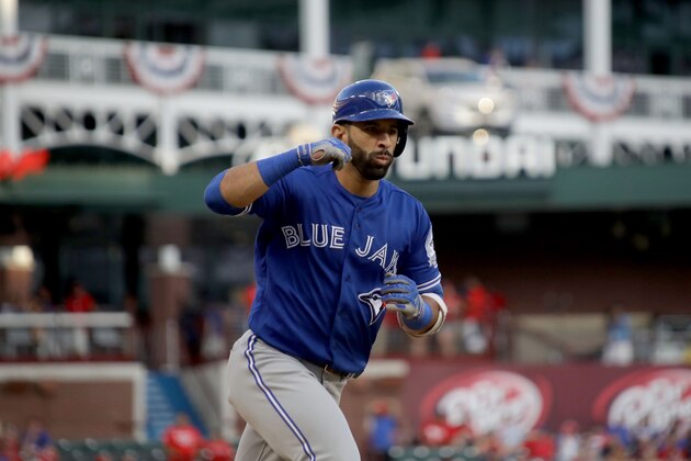 ARLINGTON, TX - OCTOBER 06:  Jose Bautista #19 of the Toronto Blue Jays celebrates after hitting a three run home run to left field agianst Jake Diekman #41 of the Texas Rangers during the ninth inning in game one of the American League Divison Series at Globe Life Park in Arlington on October 6, 2016 in Arlington, Texas.  (Photo by Ronald Martinez/Getty Images)