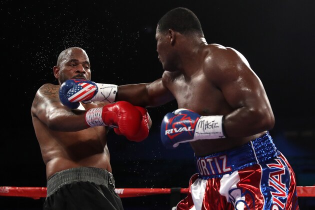 WASHINGTON, DC - MARCH 05: Luis Ortiz (right) exchanges punches with Tony Thompson in their main event heavyweight match at the DC Armory on March 5, 2016 in Washington, DC. (Photo by Patrick Smith/Getty Images)
