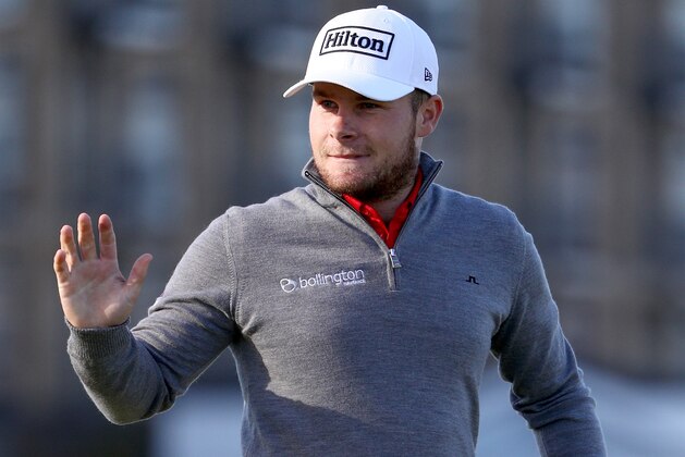 ST ANDREWS, SCOTLAND - OCTOBER 08:  Championship leader Tyrrell Hatton of England acknowledges the crowd after holing his putt on the 17th green during the third round of the Alfred Dunhill Links Championship at The Old Course on October 8, 2016 in St Andrews, Scotland.  (Photo by Ian Walton/Getty Images)