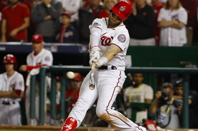 Washington Nationals Bryce Harper hits a foul ball during his at-bat in the ninth inning of Game 1 of baseball's National League Division Series against the Los Angles Dodgers at Nationals Park, Friday, Oct. 7, 2016, in Washington. Dodgers won 5-4. (AP Photo/Pablo Martinez Monsivais)