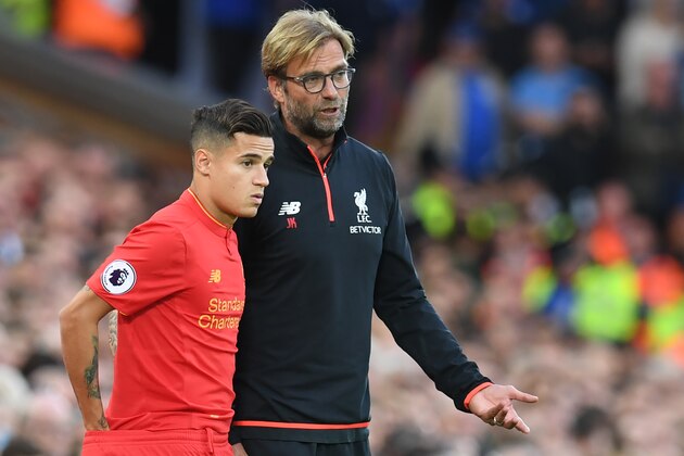 Liverpool's German manager Jurgen Klopp (R) speaks to Liverpool's Brazilian midfielder Philippe Coutinho on the touchline during the English Premier League football match between Liverpool and Leicester City at Anfield in Liverpool, north west England on September 10, 2016. / AFP / Paul ELLIS / RESTRICTED TO EDITORIAL USE. No use with unauthorized audio, video, data, fixture lists, club/league logos or 'live' services. Online in-match use limited to 75 images, no video emulation. No use in betting, games or single club/league/player publications.  /         (Photo credit should read PAUL ELLIS/AFP/Getty Images)