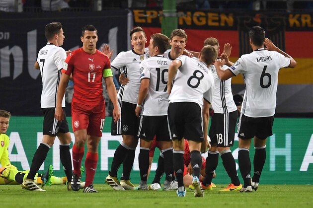 Germany's midfielder Thomas Mueller (4th R) is congratulated by teammates after scoring the 1-0 as Czech Republic's goalkeeper Tomas Vaclik (L) sits on the pitch during the 2018 World Cup qualifier football match of Germany vs Czech Republic in Hamburg, northern Germany, on October 8, 2016. / AFP / PATRIK STOLLARZ        (Photo credit should read PATRIK STOLLARZ/AFP/Getty Images)