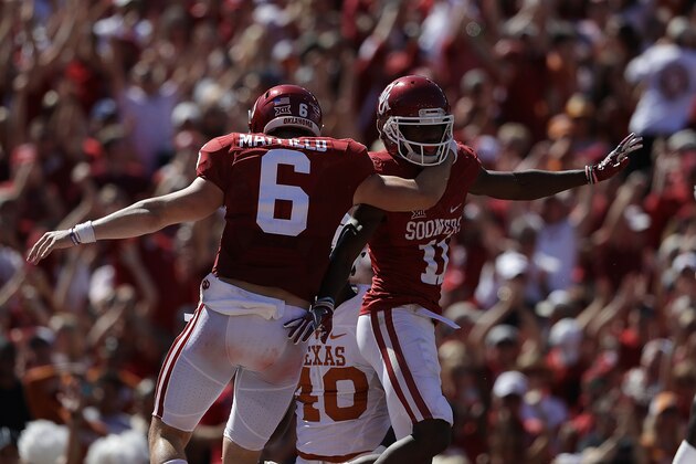 DALLAS, TX - OCTOBER 08:  Dede Westbrook #11 of the Oklahoma Sooners celebrates his touchdown with Baker Mayfield #6 against the Texas Longhorns in the third quarter at Cotton Bowl on October 8, 2016 in Dallas, Texas.  (Photo by Ronald Martinez/Getty Images)