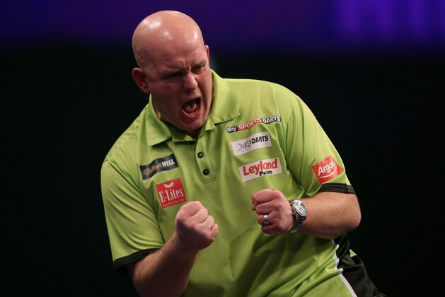 LONDON, ENGLAND - JANUARY 03:  Michael van Gerwen of the Netherlands celebrates winning a leg during his semi final match against  Gary Anderson of Scotland on day thirteen of the 2015 William Hill PDC World Darts Championships at Alexandra Palace on January 3, 2015 in London, England.  (Photo by Ben Hoskins/Getty Images)