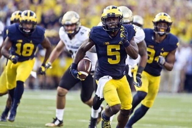 Michigan linebacker Jabrill Peppers (5) returns a punt for a touchdown in the second half of an NCAA college football game against Colorado in Ann Arbor, Mich., Saturday, Sept. 17, 2016. Michigan won 45-28. (AP Photo/Tony Ding)