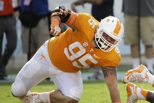 In this Sept. 5, 2015, photo, Tennessee defensive lineman Danny O'Brien (95) plays in the Vols' 59-30 win over Bowling Green in Nashville. O'Brien has been suspended for what Volunteers coach Butch Jones described as a violation of team rules and policies. Jones said Wednesday, Sept. 9, 2015, that O'Brien would miss Saturday's game with No. 19 Oklahoma (1-0) and no timetable is set for the junior's return. Jones didn't specify the nature of O'Brien's violation (AP Photo/Mark Humphrey)