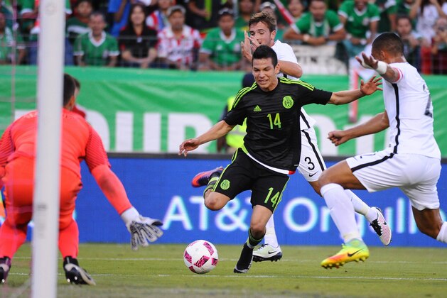 Oct 8, 2016; Nashville, TN, USA; Mexico forward Hirving Lozano (14) is fouled while attempting a shot on goal during the first half against New Zealand at Nissan Stadium. Mandatory Credit: Christopher Hanewinckel-USA TODAY Sports