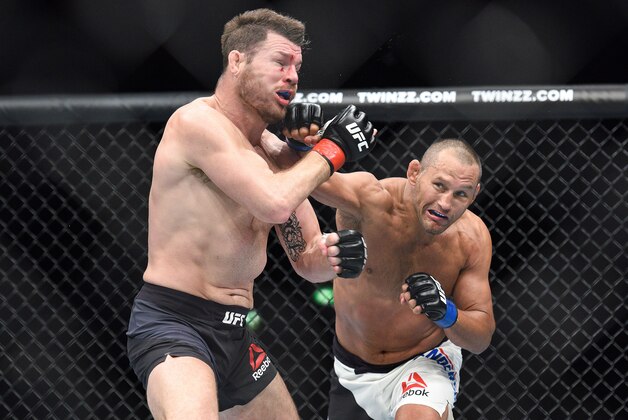 Oct 8, 2016; Manchester, UK; Michael Bisping (red gloves) fights against Dan Henderson (blue gloves) during UFC 204 at Manchester Arena. Mandatory Credit: Per Haljestam-USA TODAY Sports
