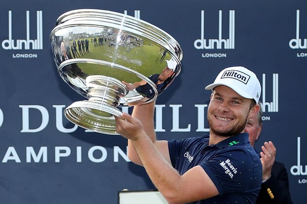 ST ANDREWS, SCOTLAND - OCTOBER 09:  Tyrrell Hatton of England holds the trophy aloft on the 18th green after winning the Alfred Dunhill Links Championship at The Old Course on October 9, 2016 in St Andrews, Scotland.  (Photo by Richard Heathcote/Getty Images)