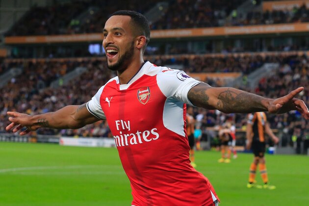 Arsenal's English midfielder Theo Walcott celebrates their second goal during the English Premier League football match between Hull City and Arsenal at the KCOM Stadium in Kingston upon Hull, north east England on September 17, 2016. / AFP / Lindsey PARNABY / RESTRICTED TO EDITORIAL USE. No use with unauthorized audio, video, data, fixture lists, club/league logos or 'live' services. Online in-match use limited to 75 images, no video emulation. No use in betting, games or single club/league/player publications.  /         (Photo credit should read LINDSEY PARNABY/AFP/Getty Images)