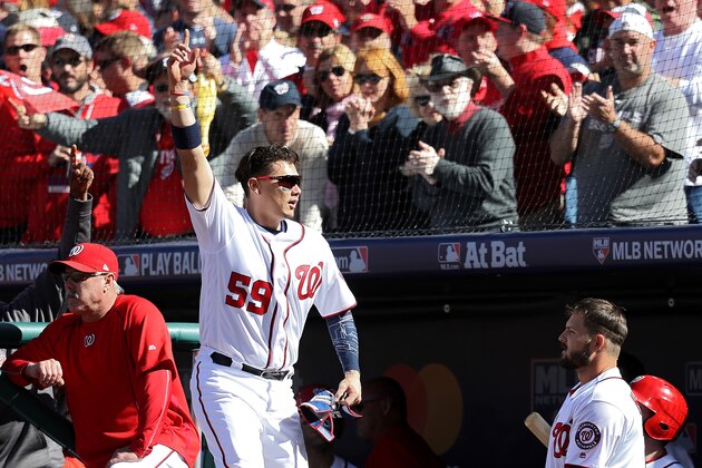 WASHINGTON, DC - OCTOBER 9: Jose Lobaton #59 of the Washington Nationals receives a curtain call after hitting a three run home run against the Los Angeles Dodgers in the fourth inning during game two of the National League Division Series at Nationals Park on October 9, 2016 in Washington, DC. (Photo by Rob Carr/Getty Images)